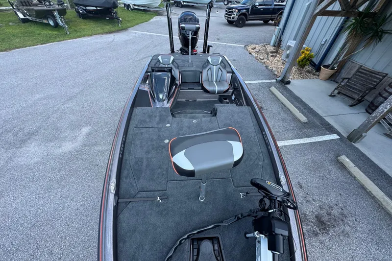 Slide: The Image of 2026 Skeeter ZXE20 boat with modern seating and equipment in a parking area. - 10