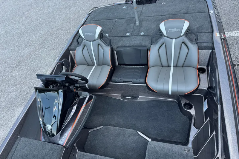 Slide: The Image of 2026 Skeeter ZXE20 boat interior with dual seats and steering console. - 12