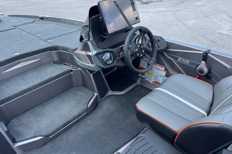 Slide: The Image of 2026 Skeeter ZXE20 boat interior with steering wheel and seating. - 14
