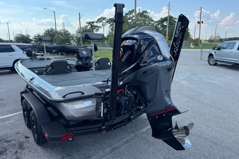 Slide: The Image of 2026 Skeeter ZXE20 boat with Yamaha engine on trailer in parking lot. - 16