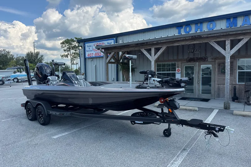 Slide: The Image of 2026 Skeeter ZXE20 boat parked outside a marine sales and service shop. - 3