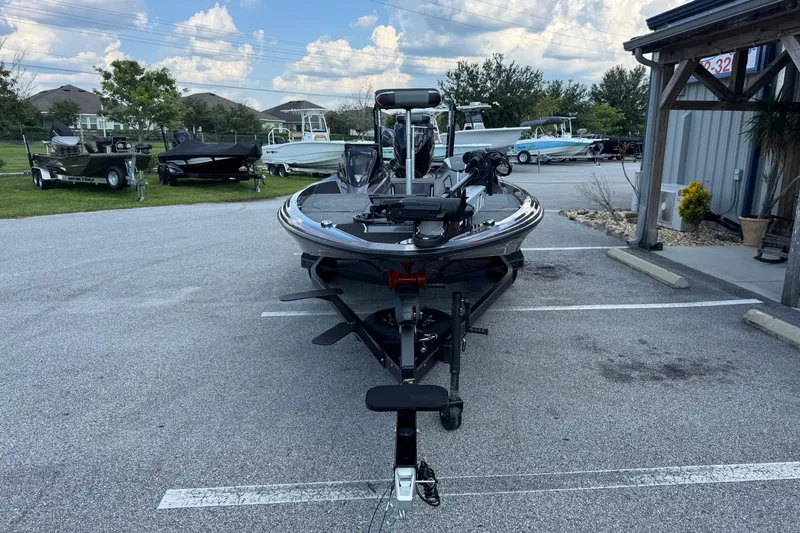 Slide: The Image of 2026 Skeeter ZXE20 boat parked outdoors on a sunny day. - 6