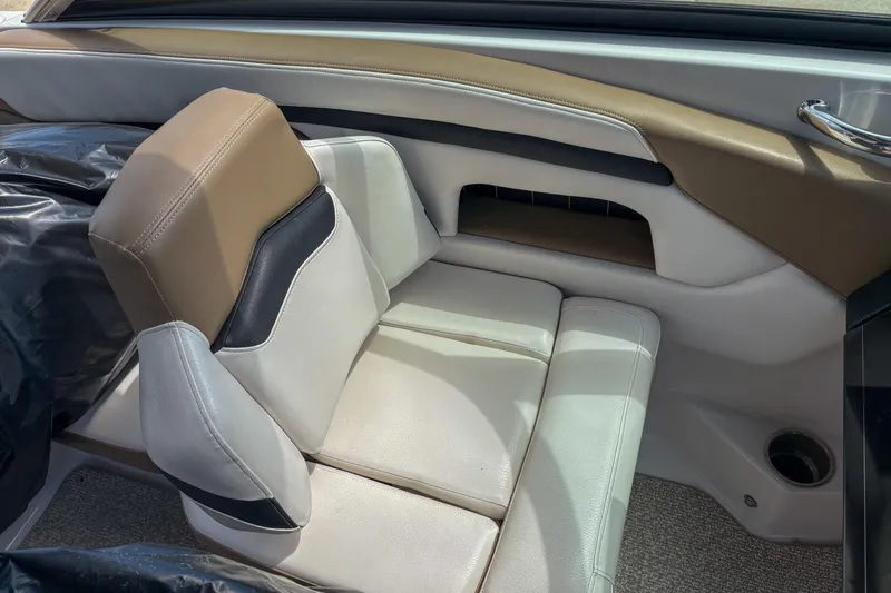 Slide: The Image of 2016 Four Winns H210 boat interior with beige and white seating. - 8
