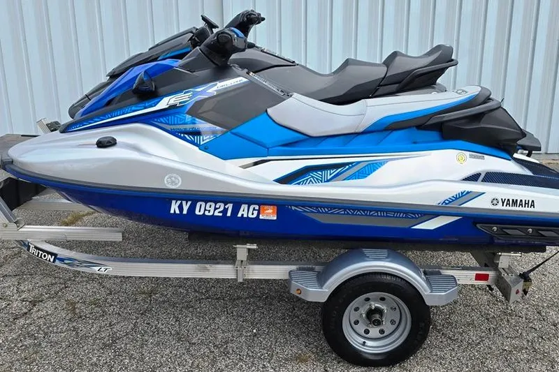 Slide: The Image of 2020 Yamaha WaveRunner jet skis on trailer, blue and white design. - 10