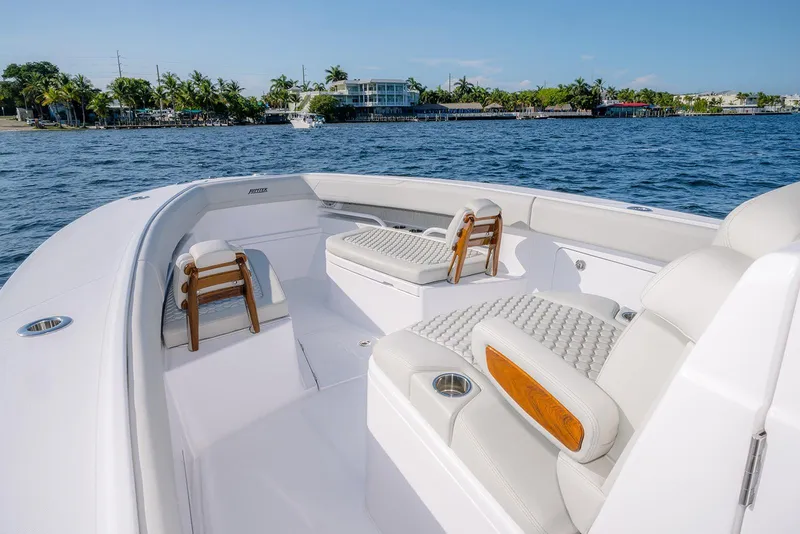 Slide: The Image of Luxurious 2026 Jupiter 340LS boat interior with plush seating, cruising on a sunny day. - 10