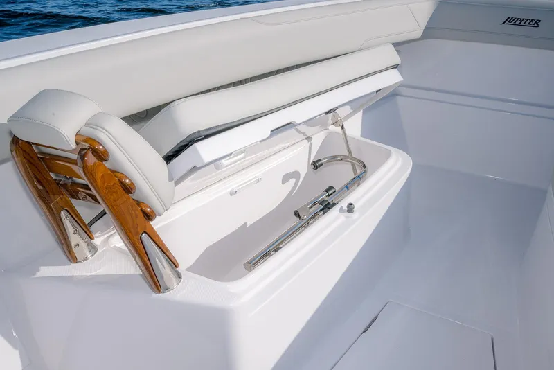 Slide: The Image of 2026 Jupiter 340LS boat interior with sleek seating and polished wood accents. - 13