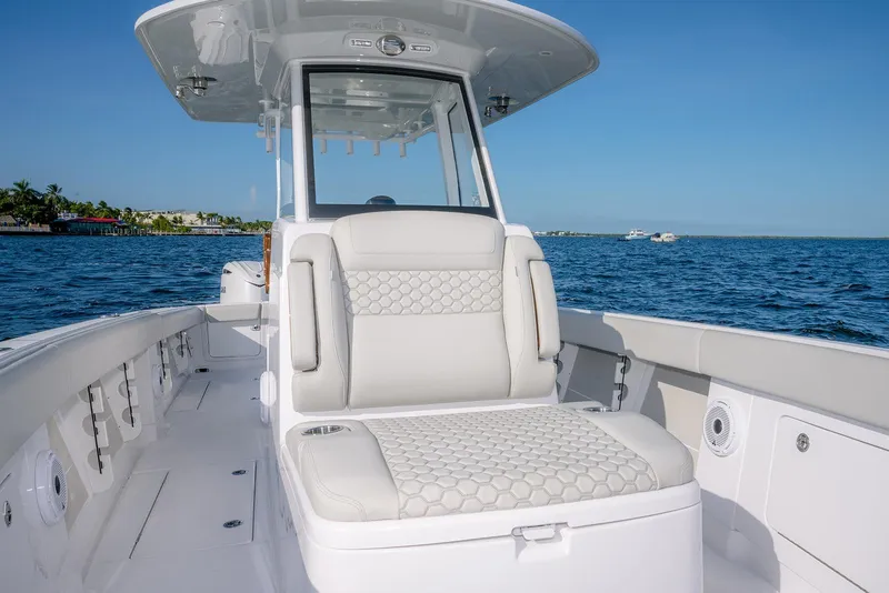 Slide: The Image of 2026 Jupiter 340LS boat interior with luxurious seating on open water. - 14