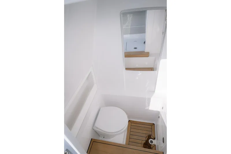 Slide: The Image of 2026 Jupiter 340LS boat bathroom with wooden flooring and mirror. - 21