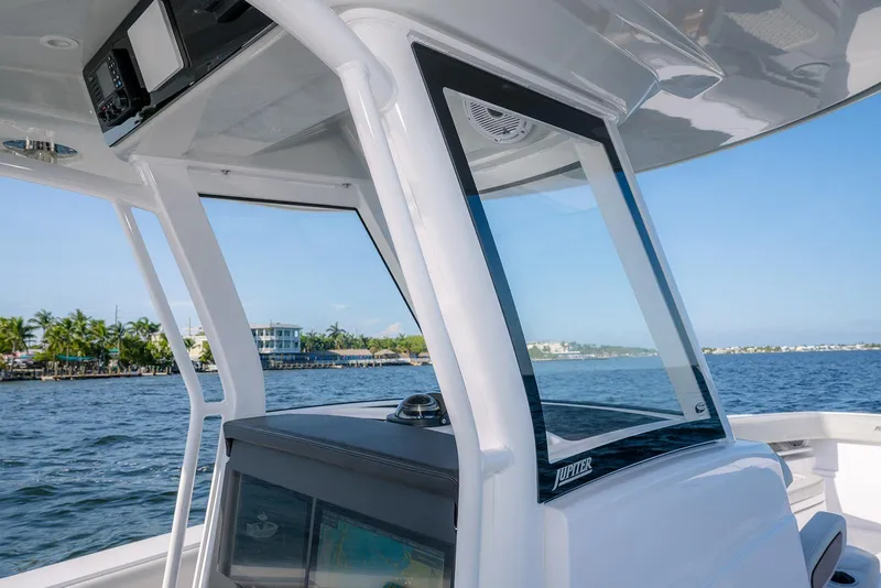 Slide: The Image of 2026 Jupiter 340LS boat console with modern design on a sunny day. - 23