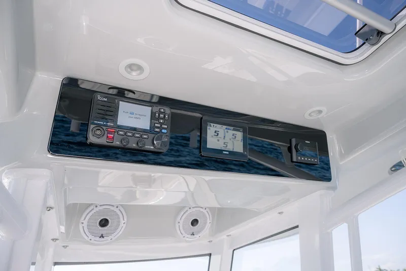 Slide: The Image of Control panel of 2026 Jupiter 340LS boat with modern navigation and communication systems. - 25