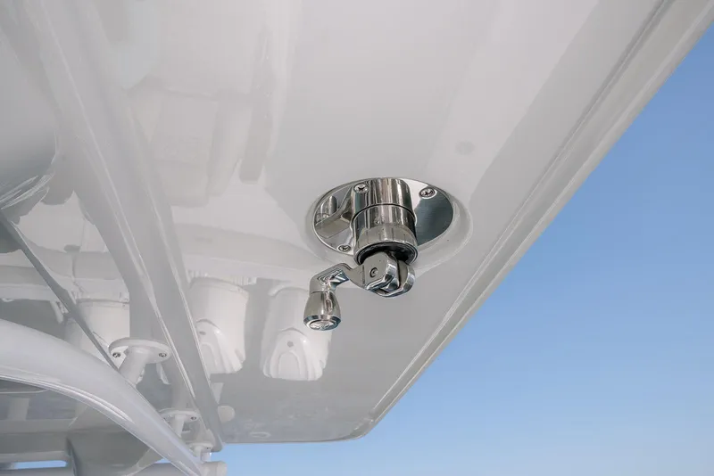 Slide: The Image of Stainless steel fitting on Jupiter 340LS boat, 2026 model, against clear blue sky. - 26