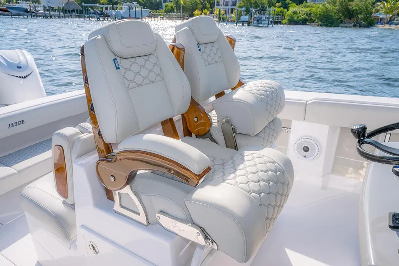Slide: The Image of Luxurious seating on 2026 Jupiter 340LS boat with elegant design and waterfront view. - 27
