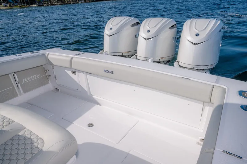 Slide: The Image of 2026 Jupiter 340LS boat with triple outboard engines on a calm sea. - 44