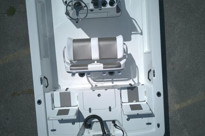 Slide: The Image of Aerial view of 2026 Froniter 2104 boat interior with seating and steering wheel. - 4