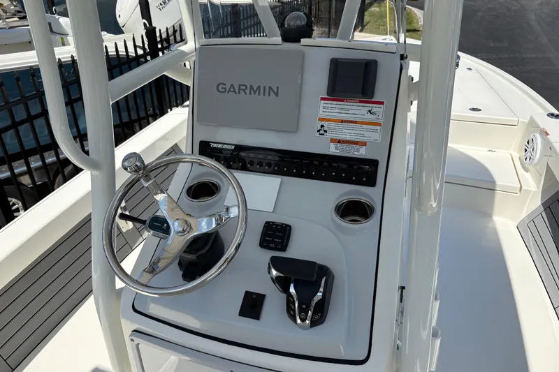 Slide: The Image of 2024 Pathfinder 2500 Hybrid boat console with Garmin navigation and steering wheel. - 10