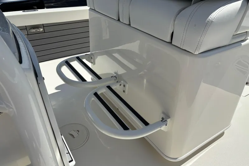 Slide: The Image of 2024 Pathfinder 2500 Hybrid boat seating with integrated footrests and sleek design. - 13