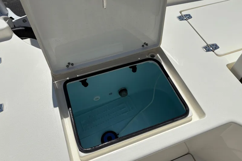 Slide: The Image of Open storage compartment on 2024 Pathfinder 2500 Hybrid boat deck. - 17