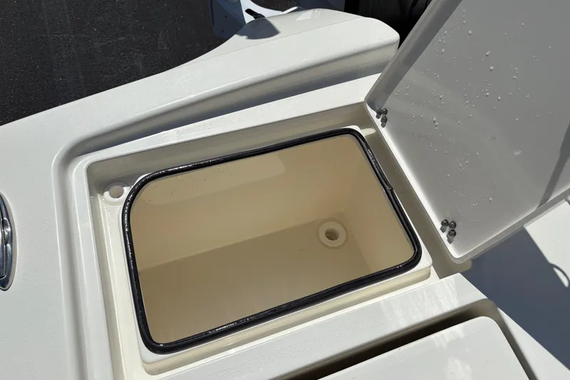 Slide: The Image of Open storage compartment on 2024 Pathfinder 2500 Hybrid boat, showcasing interior design. - 19