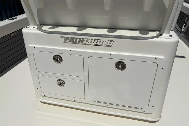 Slide: The Image of 2024 Pathfinder 2500 Hybrid boat storage compartment with secure latches and sleek design. - 22