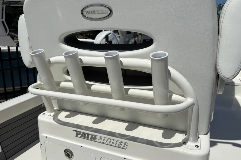 Slide: The Image of 2024 Pathfinder 2500 Hybrid boat seat with rod holders and logo detail. - 24