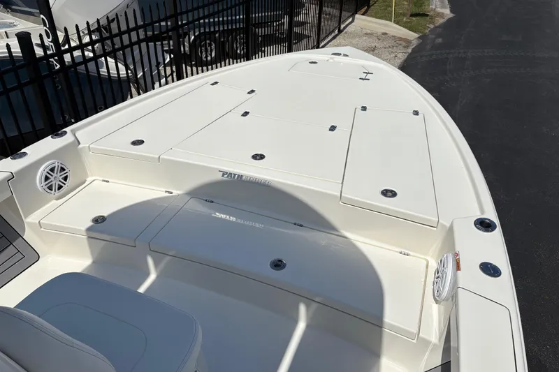 Slide: The Image of 2024 Pathfinder 2500 Hybrid boat deck with storage compartments and speakers. - 5