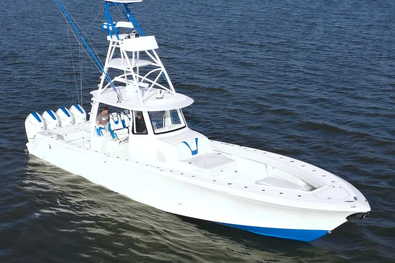 Slide: The Image of 2024 SeaVee 420Z boat on open water, featuring multiple outboard engines. - 11