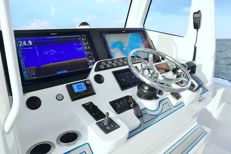 Slide: The Image of 2024 SeaVee 420Z boat dashboard with advanced navigation and control systems. - 12