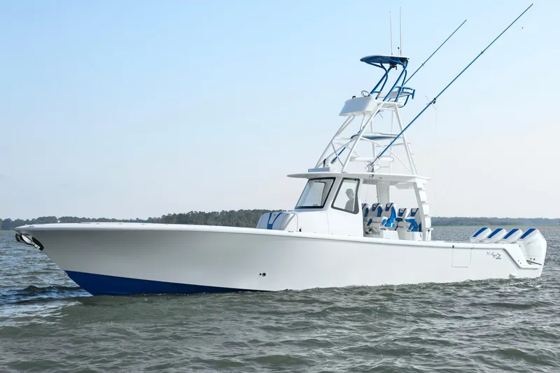 Slide: The Image of 2024 SeaVee 420Z boat cruising on open water, showcasing sleek design and fishing equipment. - 4