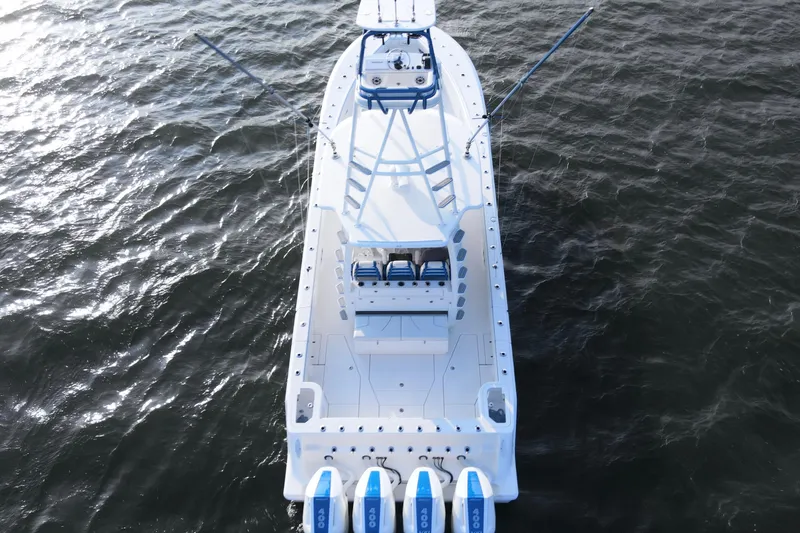 Slide: The Image of 2024 SeaVee 420Z boat on water, aerial view, showcasing sleek design and powerful engines. - 9