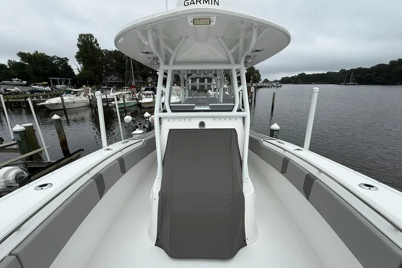 Slide: The Image of 2022 Cape Horn 34 XS boat docked at marina, featuring sleek design and spacious deck. - 13