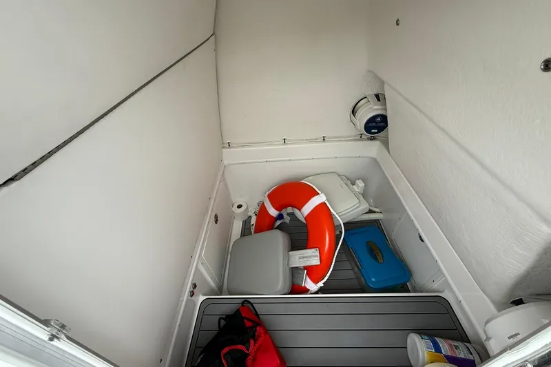 Slide: The Image of Interior storage of 2022 Cape Horn 34 XS boat with safety equipment and supplies. - 18