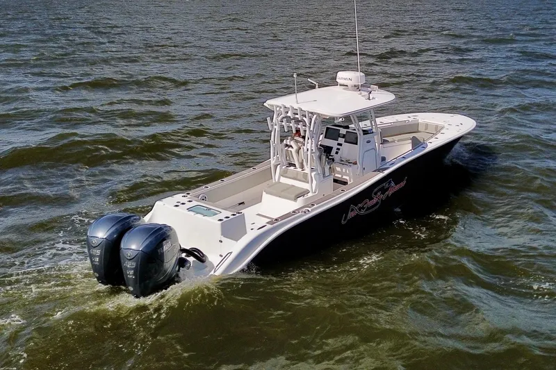 Slide: The Image of 2022 Cape Horn 34 XS boat cruising on open water with twin engines. - 6