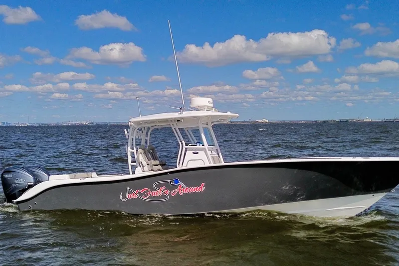 The Image of 2022 Cape Horn 34 XS boat cruising on open water under a blue sky. - 0