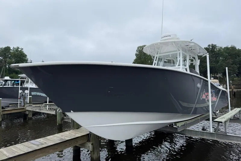 Slide: The Image of 2022 Cape Horn 34 XS boat docked, featuring sleek design and modern structure. - 10