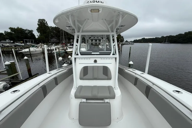 Slide: The Image of 2022 Cape Horn 34 XS boat docked by a serene waterfront. - 14