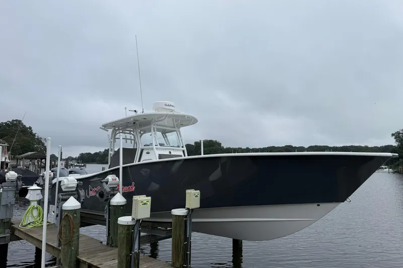 Slide: The Image of 2022 Cape Horn 34 XS boat docked on a cloudy day. - 7