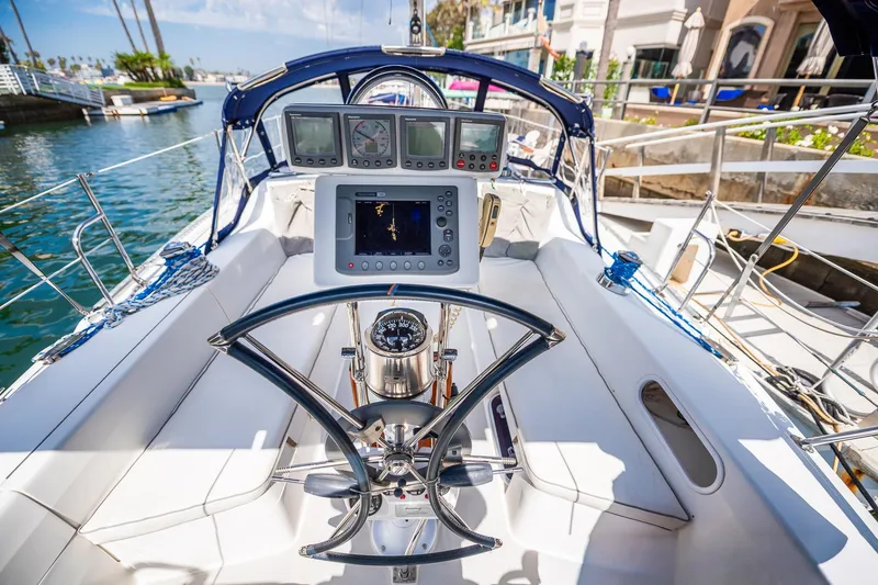 Slide: The Image of Cockpit of 2005 Catalina 36 MkII sailboat with navigation instruments and steering wheel. - 13