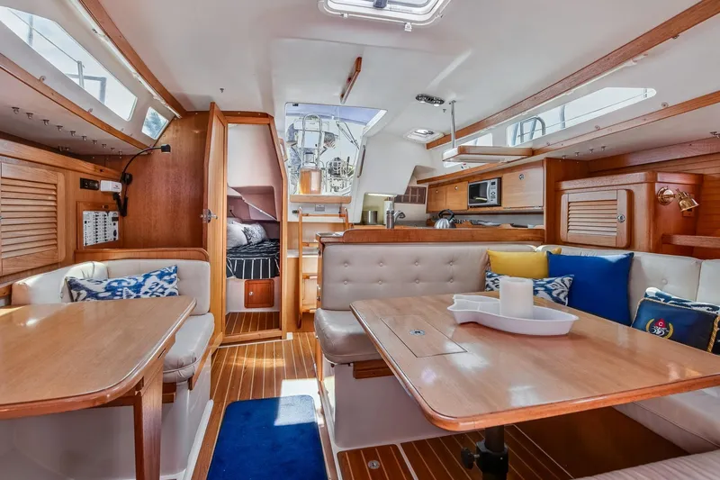Slide: The Image of Interior of 2005 Catalina 36 MkII sailboat with cozy seating and wooden finishes. - 28