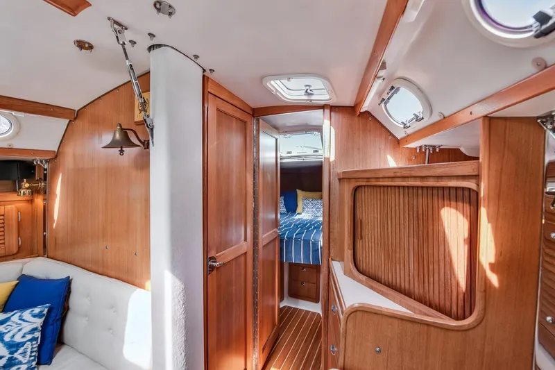 Slide: The Image of Interior of 2005 Catalina 36 MkII sailboat with wood paneling and cozy cabin. - 34