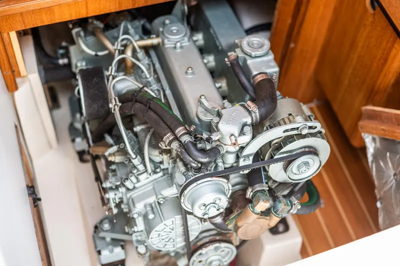 Slide: The Image of Engine compartment of a 2005 Catalina 36 MkII sailboat, showcasing mechanical components. - 35