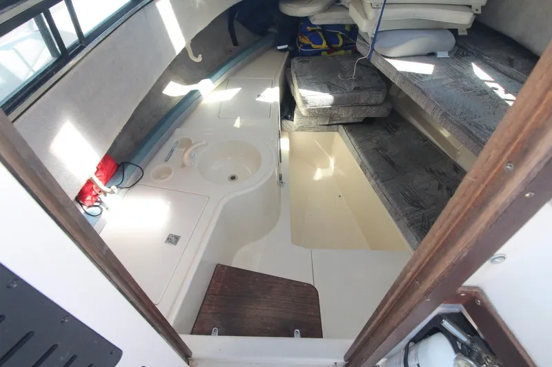 Slide: The Image of Interior cabin of 1992 Grady-White Gulfstream 232 boat with seating and sink. - 13