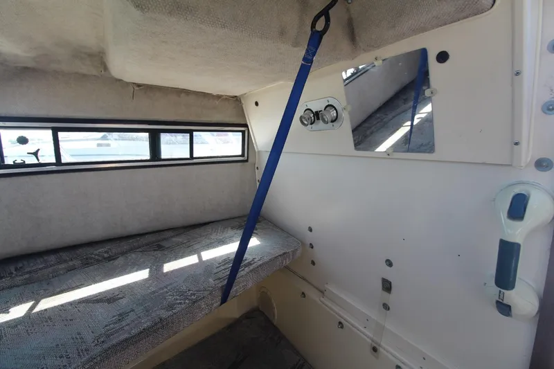 Slide: The Image of Interior cabin of 1992 Grady-White Gulfstream 232 boat with seating and window. - 16