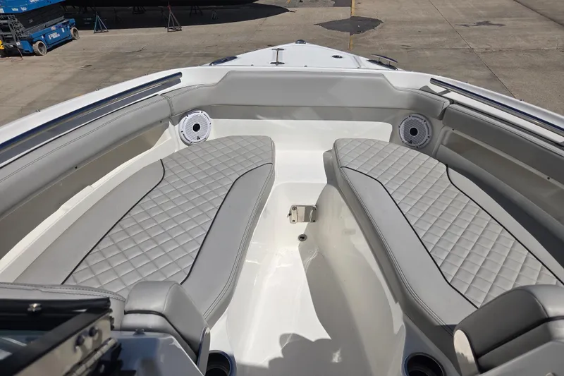 Slide: The Image of 2023 Pursuit DC 266 Dual Console boat with spacious seating and modern design. - 11