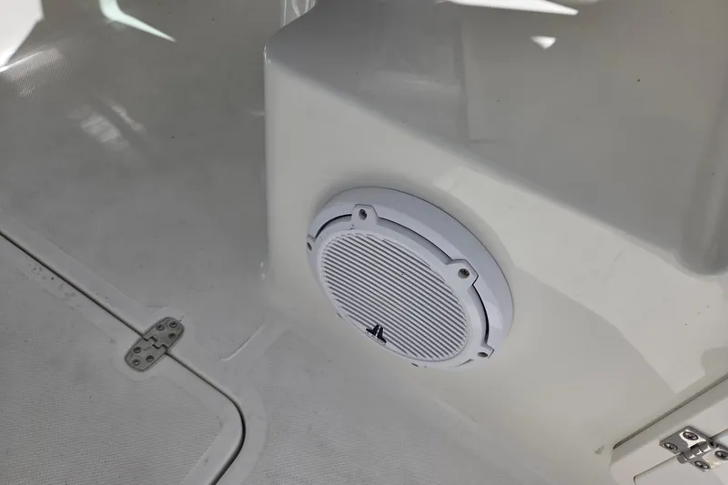 Slide: The Image of 2023 Pursuit DC 266 Dual Console boat interior with white speaker detail. - 20