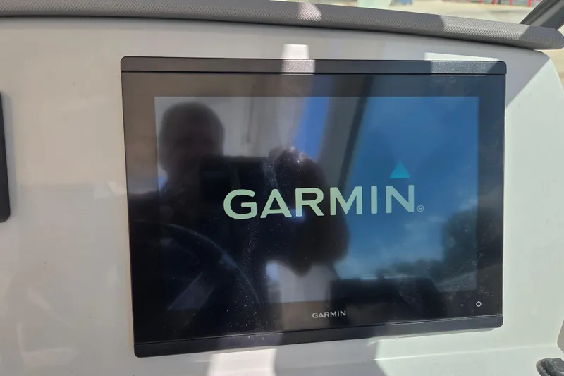 Slide: The Image of Garmin display on 2023 Pursuit DC 266 Dual Console boat dashboard. - 25