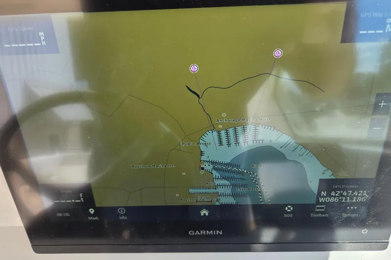 Slide: The Image of Garmin GPS display on 2023 Pursuit DC 266 Dual Console boat, showing marina map. - 26