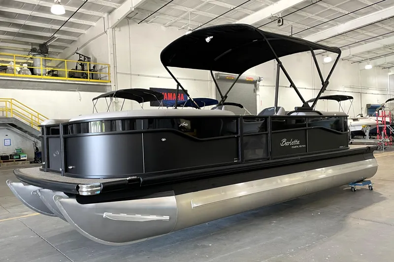 The Image of 2026 Barletta Aria 22QC Coastal Edition pontoon boat in a storage facility. - 0