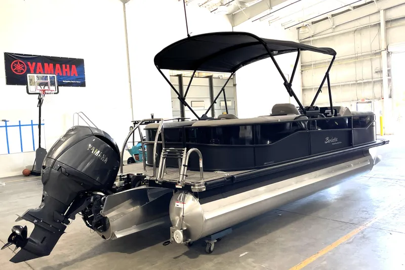 Slide: The Image of Close-up of Barletta ARIA 22QC 2026 boat trailer wheel mechanism. - 6