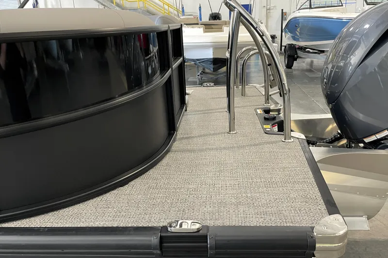 Slide: The Image of 2026 Barletta ARIA 22QC pontoon boat with sleek design and modern features. - 11