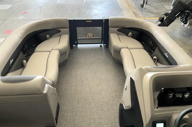 Slide: The Image of 2026 Barletta ARIA 22QC pontoon boat interior with plush seating and modern dashboard. - 16